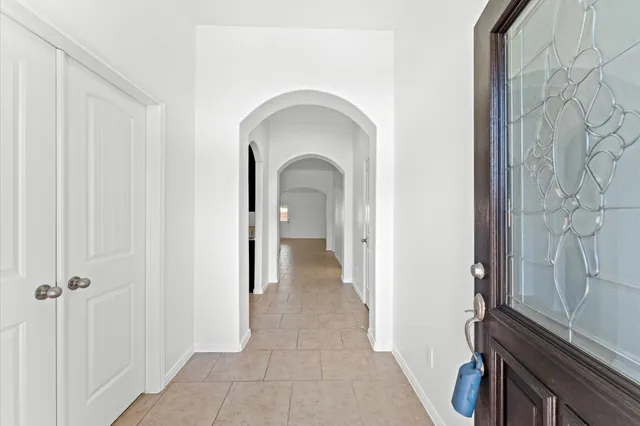 a view of a livingroom with wooden floor and a sink