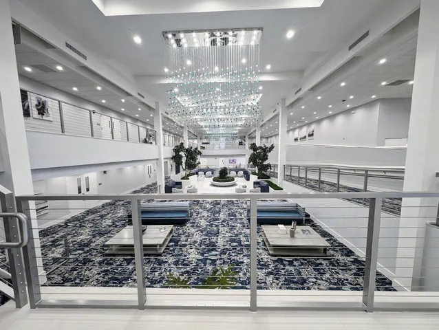 a living room with lots of furniture and gym equipment