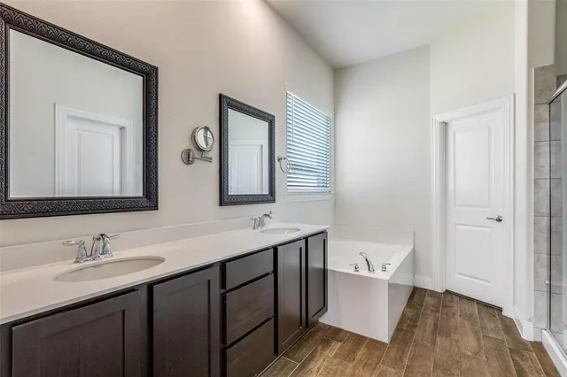 a bathroom that has a glass shower door