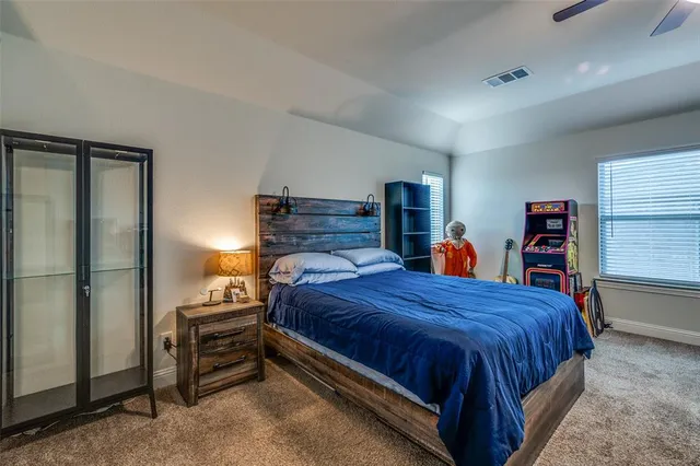 a living room with furniture a flat screen tv and a window