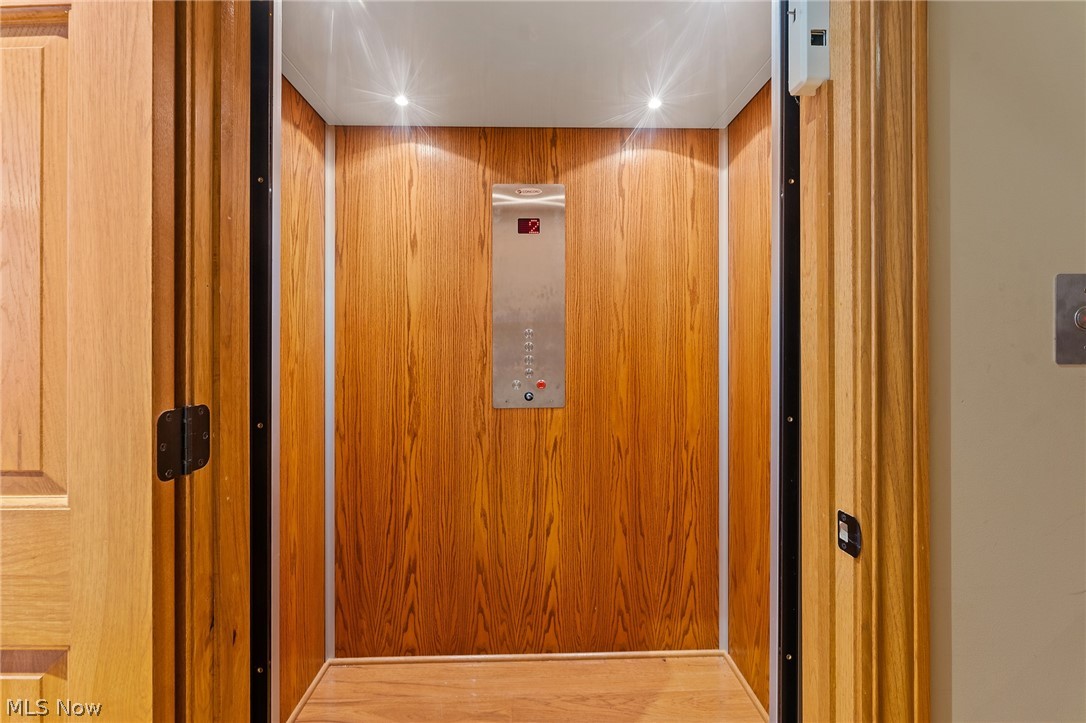 13721 Beaver Springfield Road New Springfield, OH 44443 - Photo 14 of 48 Interior details with elevator and hardwood / wood-style flooring