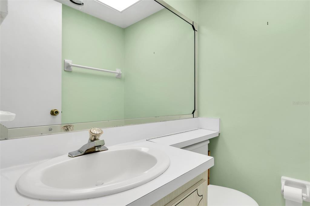 4743 Jasper Drive, Unit 204 New Port Richey, FL 34652 - Photo 12 of 17 a bathroom with a sink and a toilet