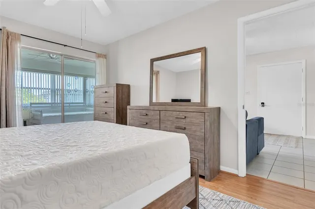 a bedroom with a bed and a dresser