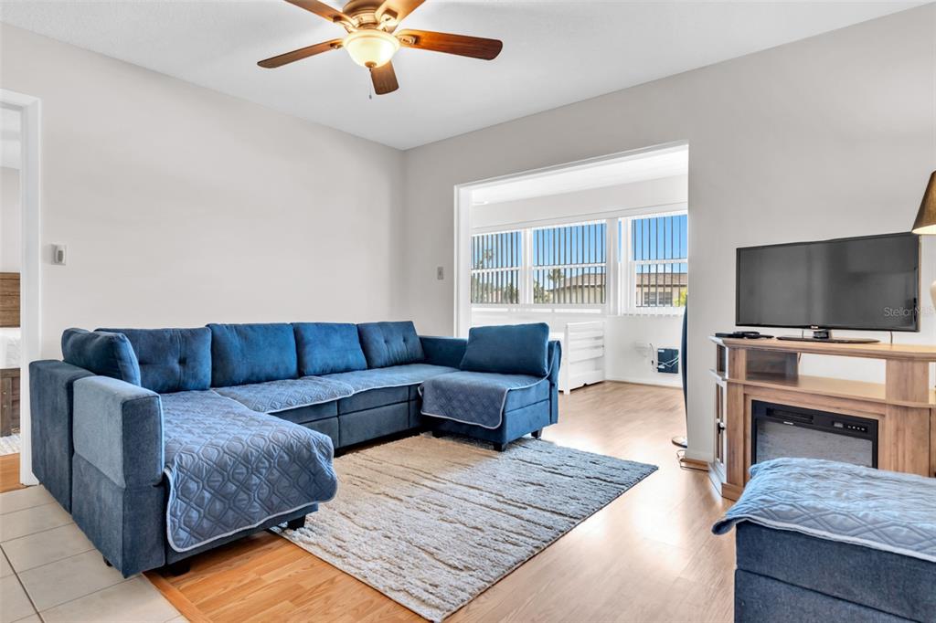 4743 Jasper Drive, Unit 204 New Port Richey, FL 34652 - Photo 9 of 17 a living room with furniture and a flat screen tv