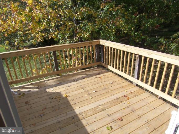 7909 Hart Road Fort Washington, MD 20744 - Photo 2 of 21 a view of balcony with wooden floor