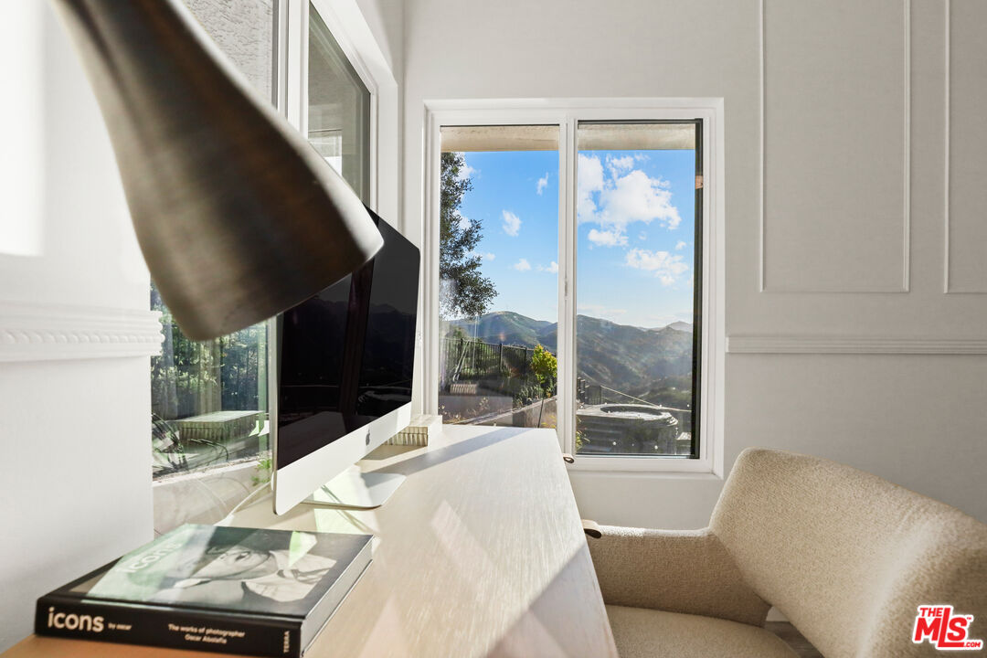 53 Saddlebow Road Bell Canyon, CA 91307 - Photo 53 of 66 a living room with furniture and a floor to ceiling window