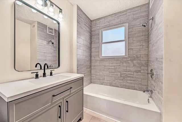 a bathroom with a sink and a bathtub