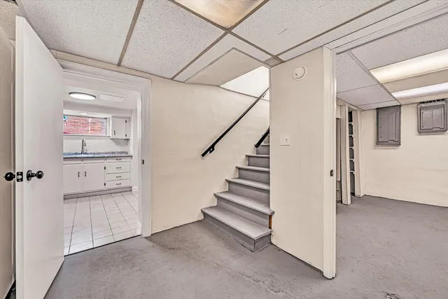 a view of a hallway with entryway with stairs