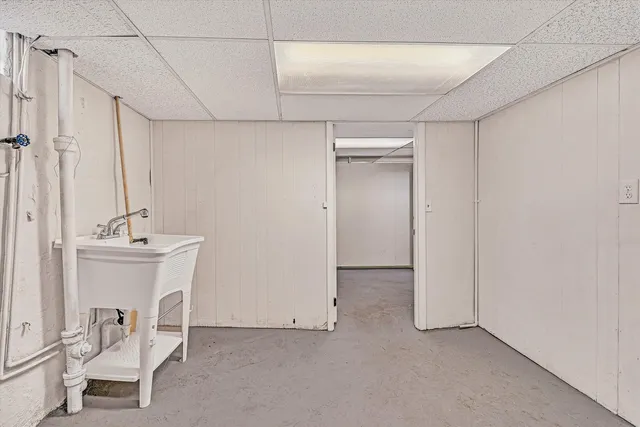 a bathroom with a sink and mirror