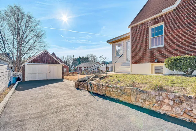 a view of wooden house with a yard