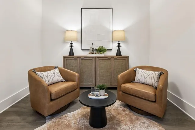 a living room with furniture and lamp