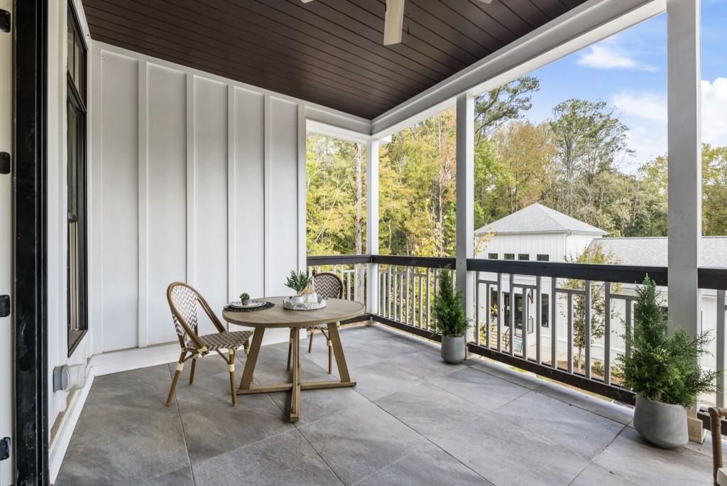 12455 Broadwell Road, Unit 201 Milton, GA 30004 - Photo 17 of 38 a view of a porch with furniture and wooden floor