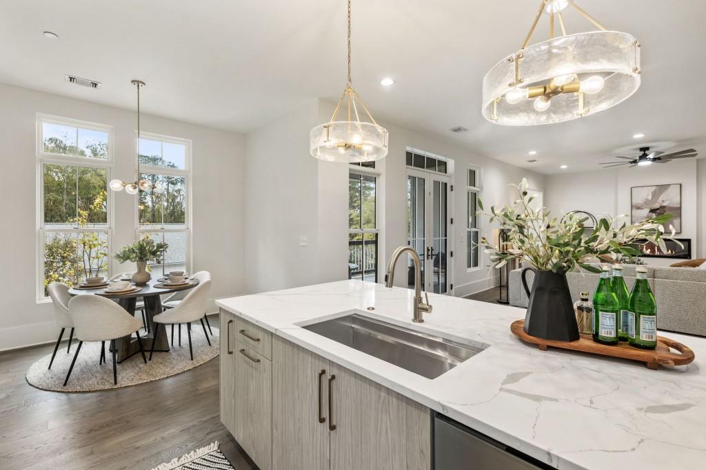 12455 Broadwell Road, Unit 201 Milton, GA 30004 - Photo 23 of 38 a kitchen with a table and chairs