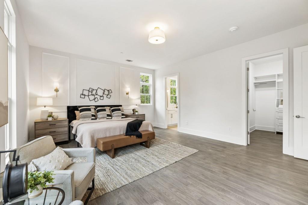 12455 Broadwell Road, Unit 201 Milton, GA 30004 - Photo 29 of 38 a bedroom with furniture and a lamp