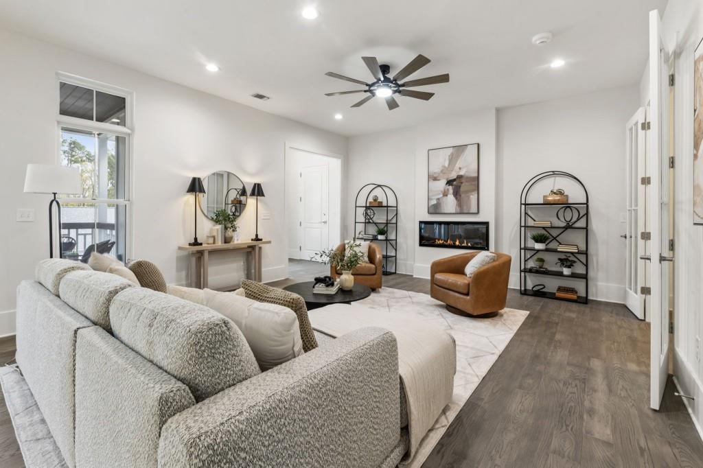 12455 Broadwell Road, Unit 201 Milton, GA 30004 - Photo 3 of 38 a living room with furniture and a chandelier