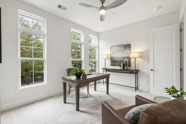 a living room with furniture and windows