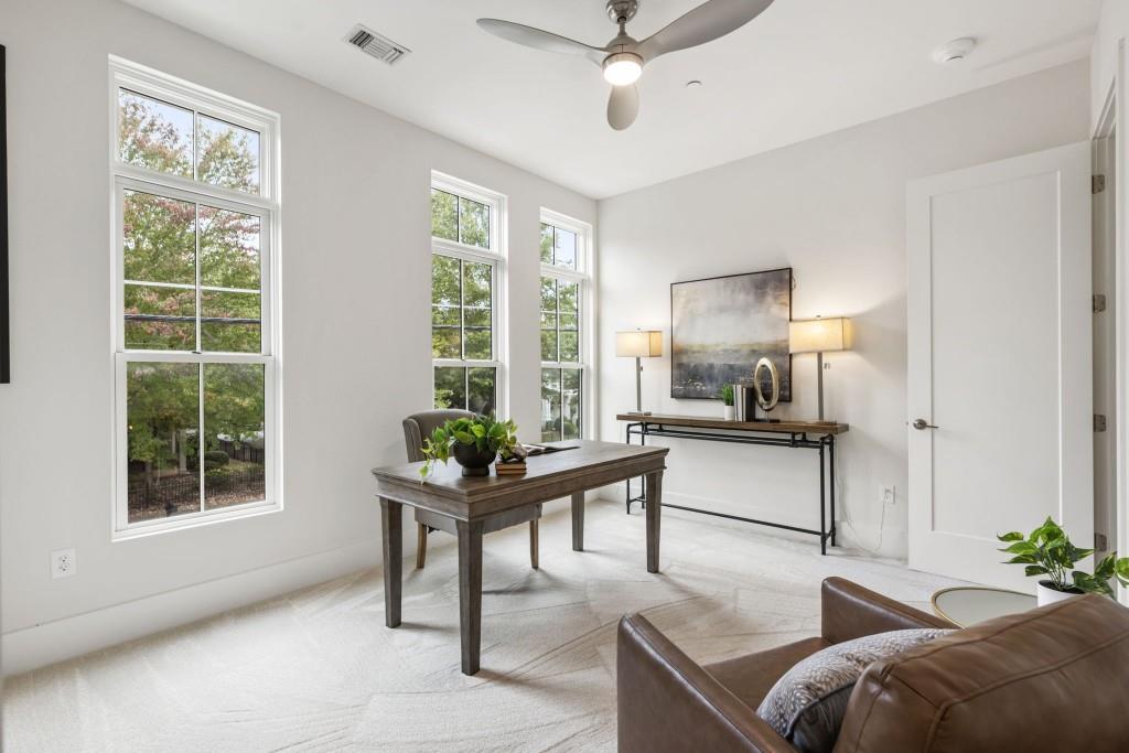 12455 Broadwell Road, Unit 201 Milton, GA 30004 - Photo 34 of 38 a living room with furniture and windows
