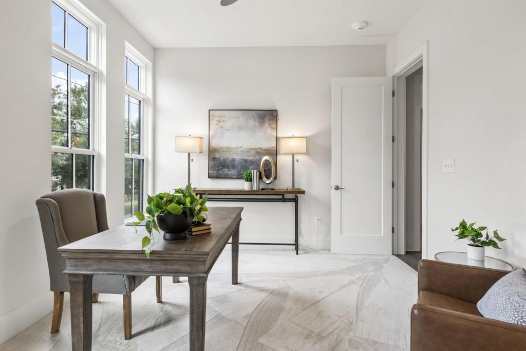 12455 Broadwell Road, Unit 201 Milton, GA 30004 - Photo 35 of 38 a living room with furniture and a potted plant