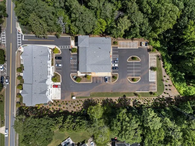 an aerial view of a house with a yard