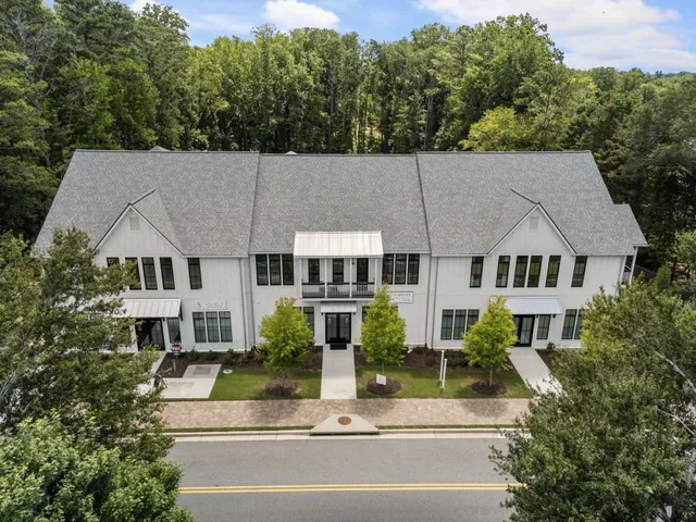 an aerial view of a house with a garden