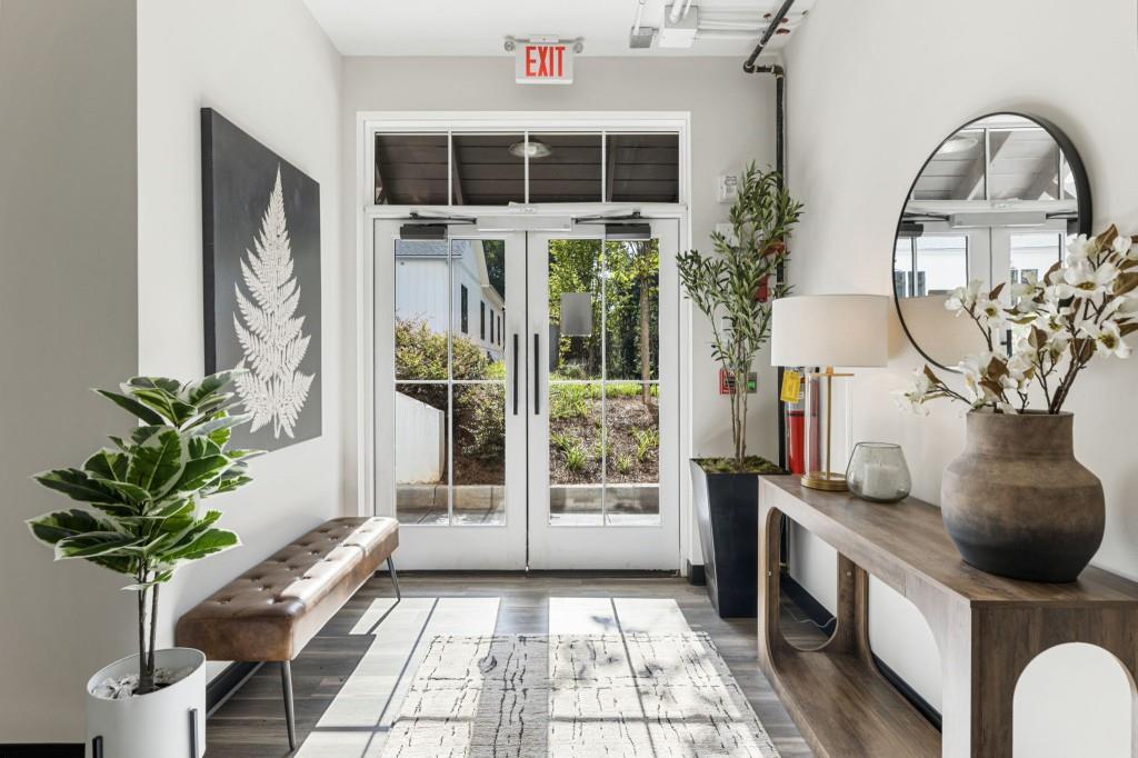 12455 Broadwell Road, Unit 201 Milton, GA 30004 - Photo 7 of 38 a front view of a house with garden