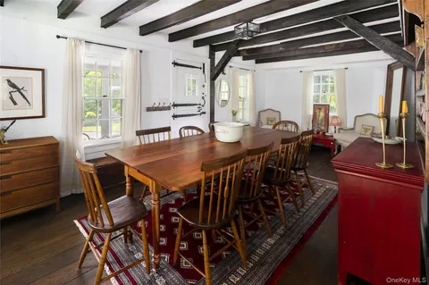 a view of a dining room with furniture and window