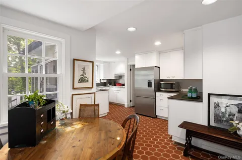 a kitchen with refrigerator cabinets and furniture