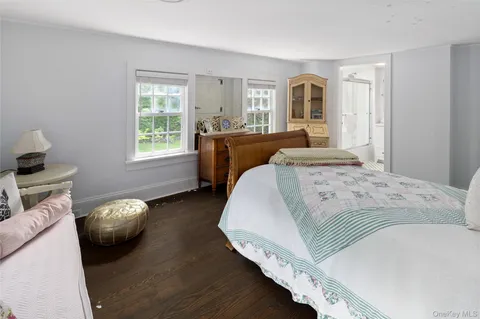 a bedroom with bed and window