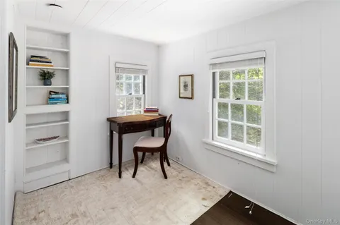 a workspace with furniture and window