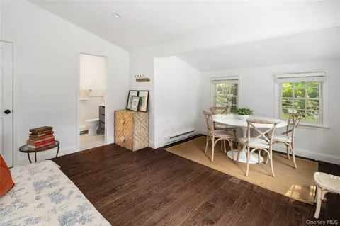 a bedroom with furniture and wooden floor