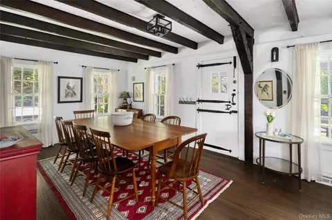 a view of a dining room with furniture and window