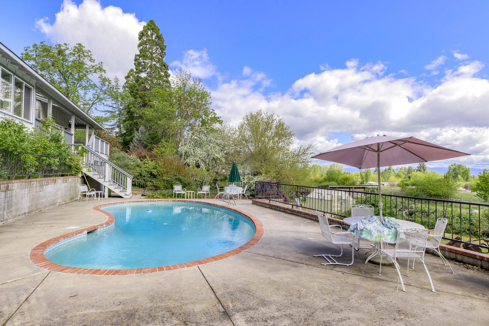 2708 Old Stage Road Central Point, OR 97502 - Photo 5 of 39 a view of a swimming pool with a patio