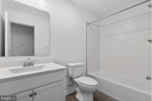 a bathroom with a sink a toilet and a bathtub