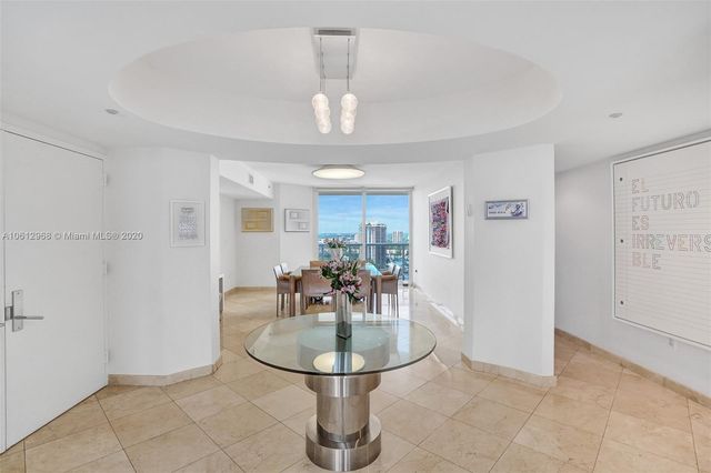 a kitchen with stainless steel appliances granite countertop a refrigerator sink and cabinets