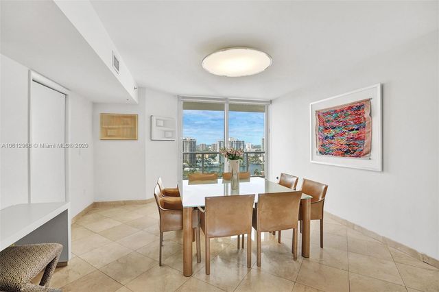 a view of a dining room with furniture and window
