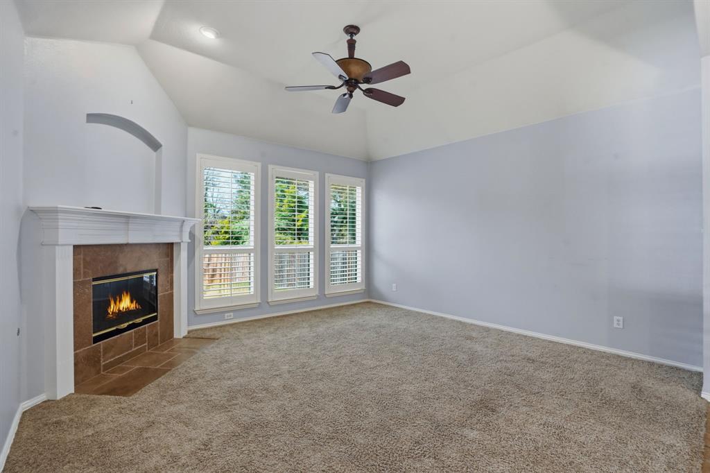 5913 Independence Court Rowlett, TX 75089 - Photo 13 of 27 a living room with furniture and a fireplace