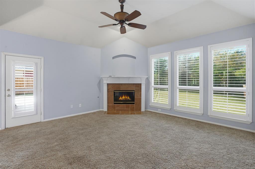 5913 Independence Court Rowlett, TX 75089 - Photo 14 of 27 a view of a room with windows and fireplace