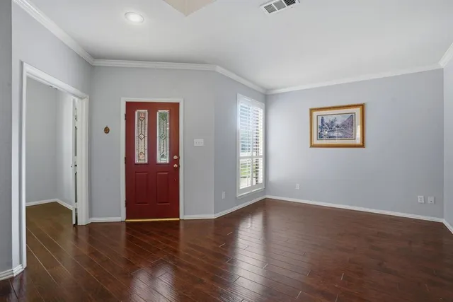 a view of livingroom with hardwood floor and hallway