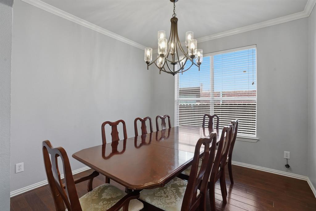 5913 Independence Court Rowlett, TX 75089 - Photo 7 of 27 a view of a dining room with furniture wooden floor and chandelier
