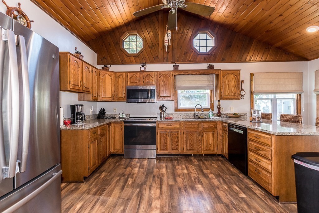 14 Wenonah Road Wareham, MA 02532 - Photo 11 of 40 a kitchen with stainless steel appliances granite countertop a stove a sink and a refrigerator