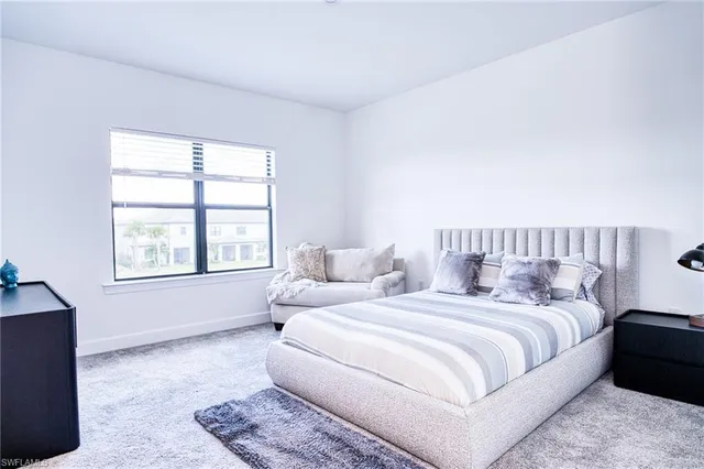 a bedroom with a bed and a cabinets