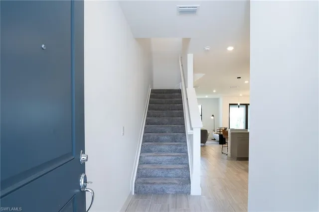 a bedroom with bed and a window