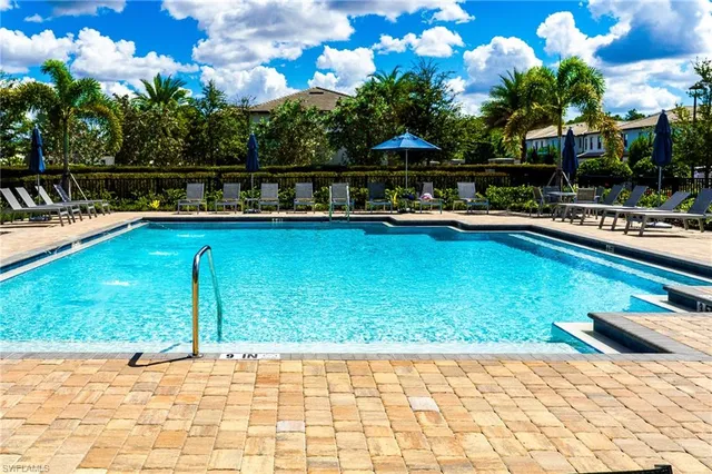 a view of swimming pool with seating space