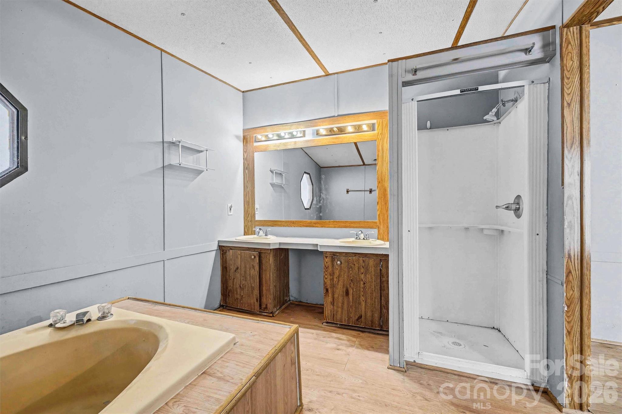 1612 Honeysuckle Pond Road Rock Hill, SC 29732 - Photo 14 of 26 a bathroom with a granite countertop sink mirror and shower