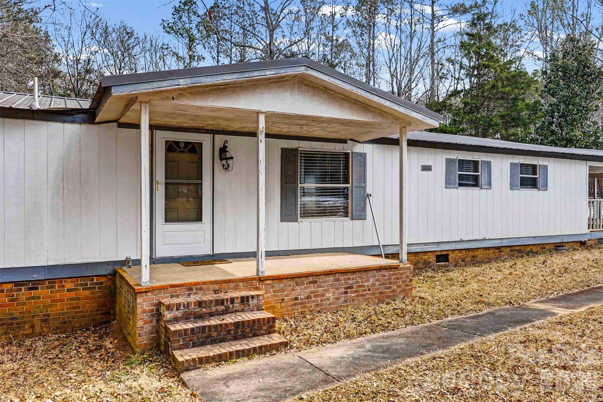 1612 Honeysuckle Pond Road Rock Hill, SC 29732 - Photo 2 of 26 a front view of a house with garden