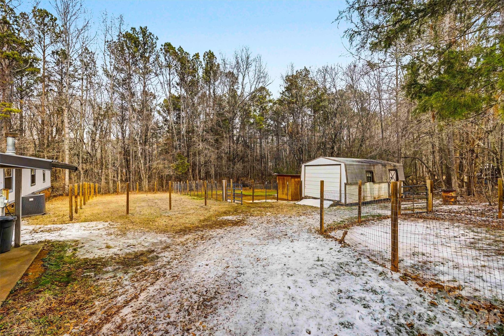 1612 Honeysuckle Pond Road Rock Hill, SC 29732 - Photo 22 of 26 a backyard of a house with table and chairs