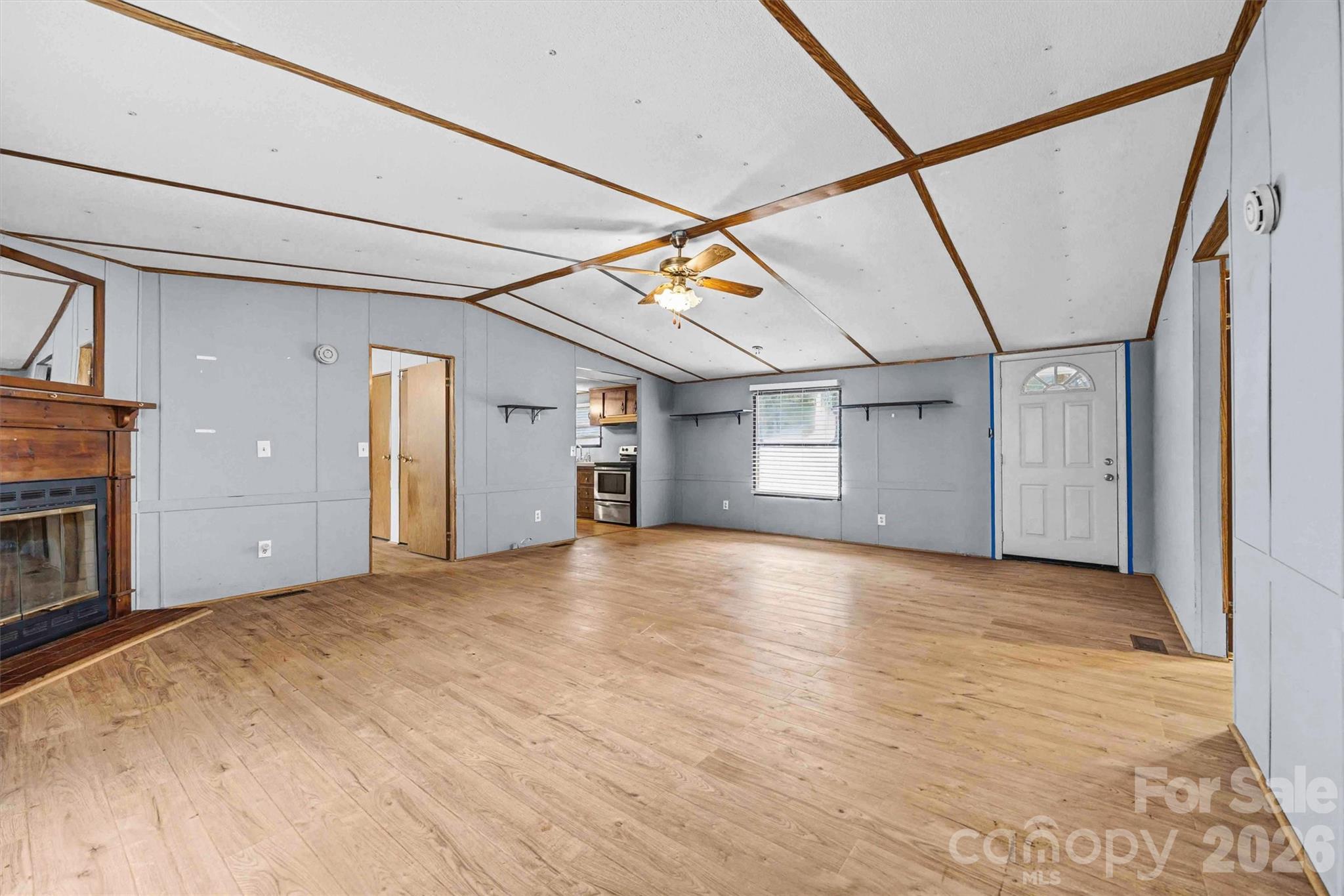 1612 Honeysuckle Pond Road Rock Hill, SC 29732 - Photo 5 of 26 a view of an empty room with a fireplace and a window