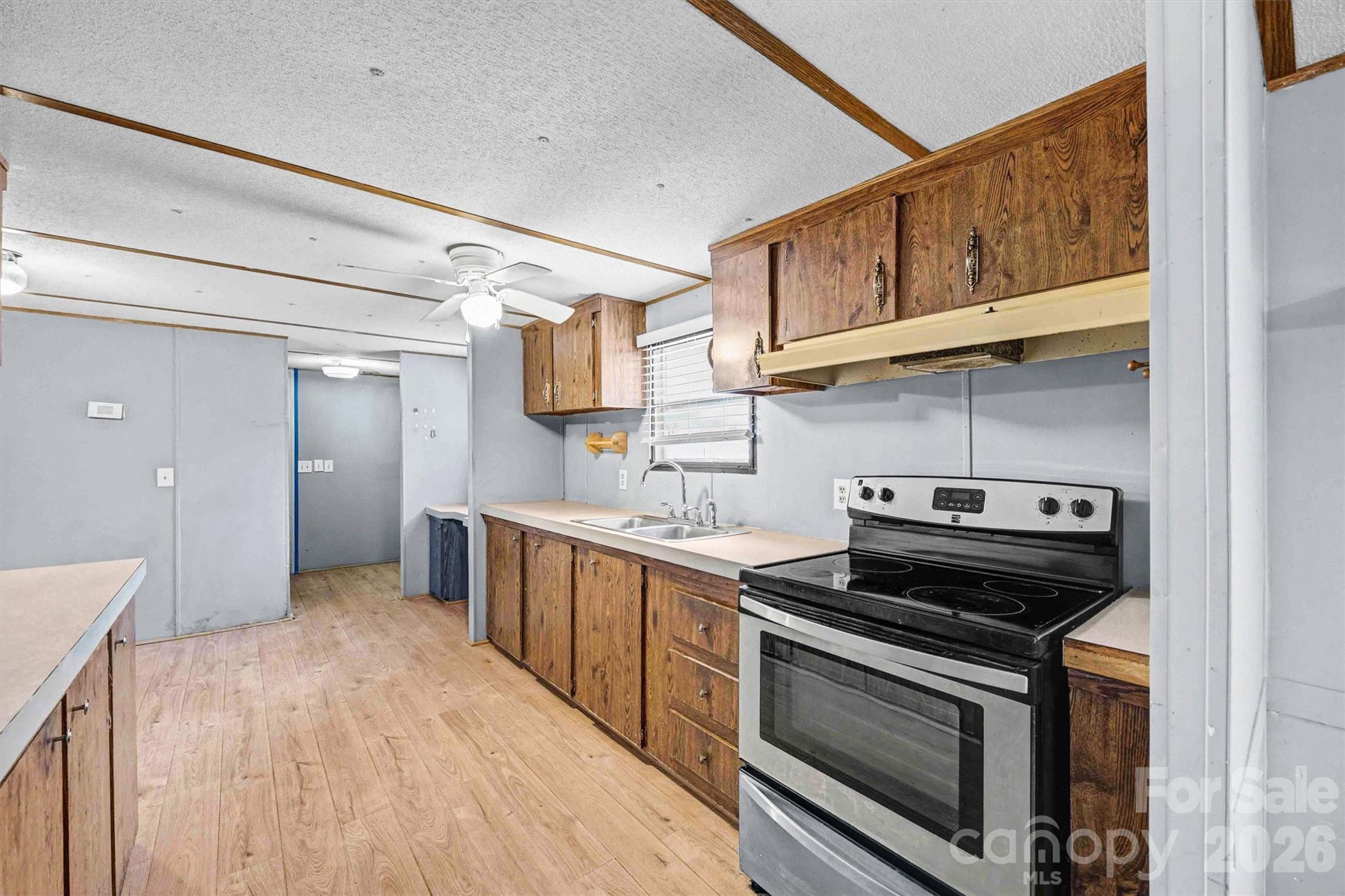 1612 Honeysuckle Pond Road Rock Hill, SC 29732 - Photo 8 of 26 a kitchen with stainless steel appliances granite countertop a stove and a sink