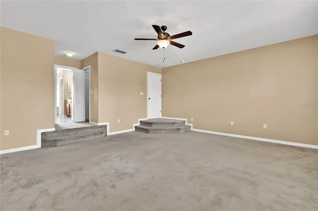 a view of a livingroom with a ceiling fan