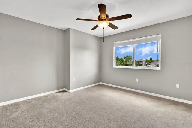 a view of room with ceiling fan